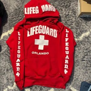 Red lifeguard sweater. Orlando, Florida.